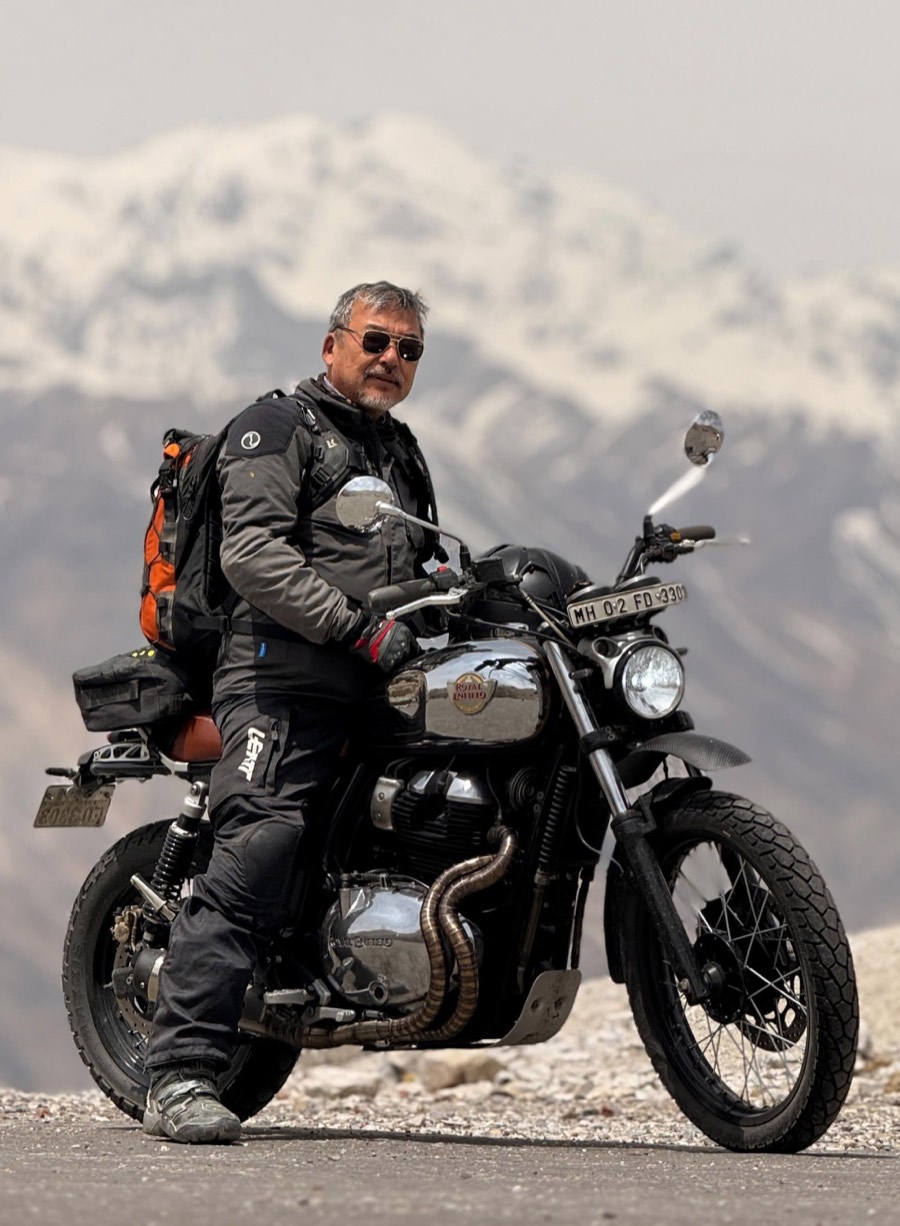 Harsh Man Rai on a Royal Enfield at altitude